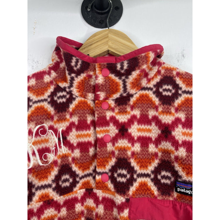 Patagonia women’s Lightweight Synchilla Snap-T Pullover in pink Aztec print L